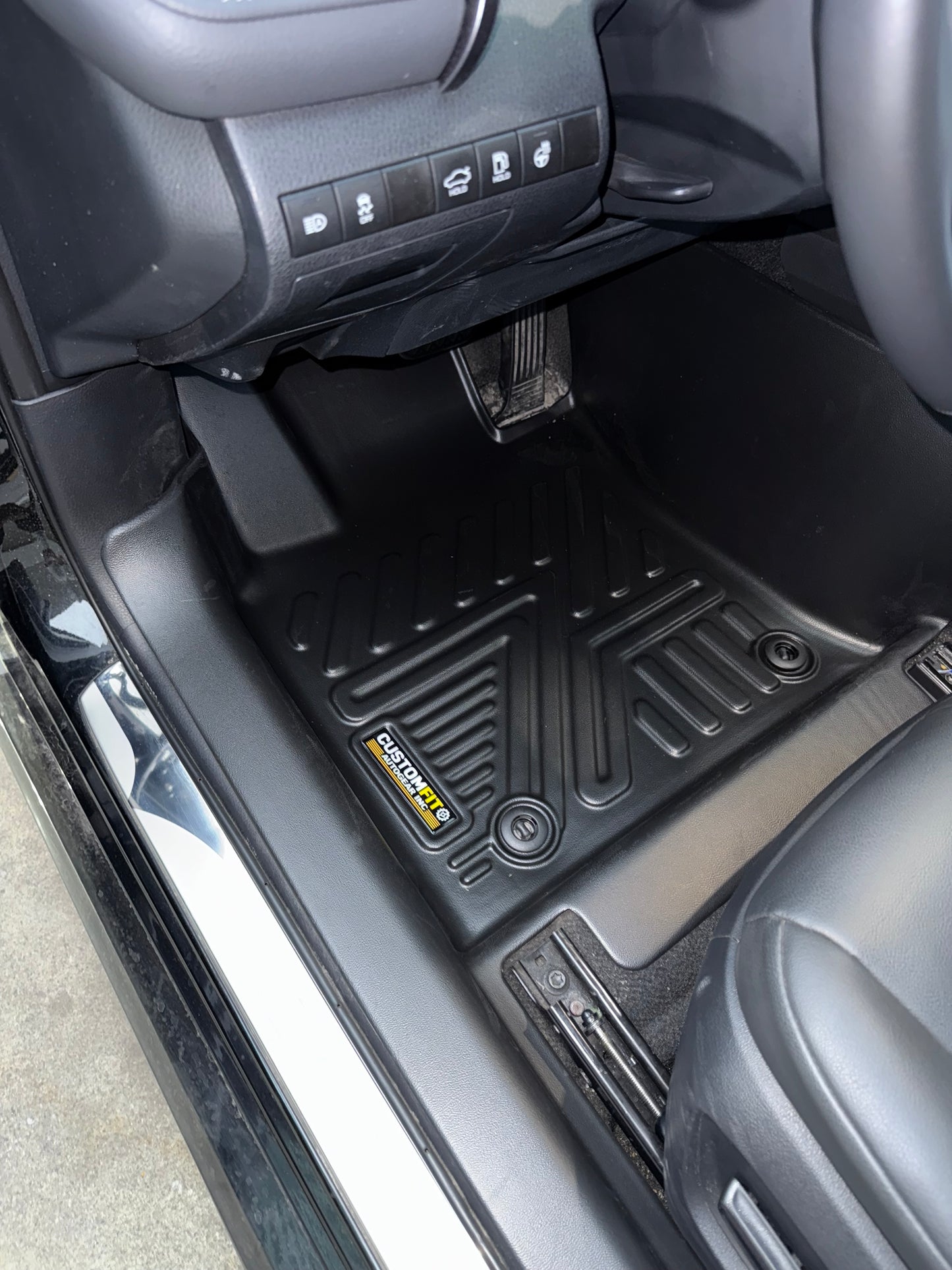 2018-2024 Toyota Camry Hybrid Driver Seat Car interior with 5D black floor mats installed.
