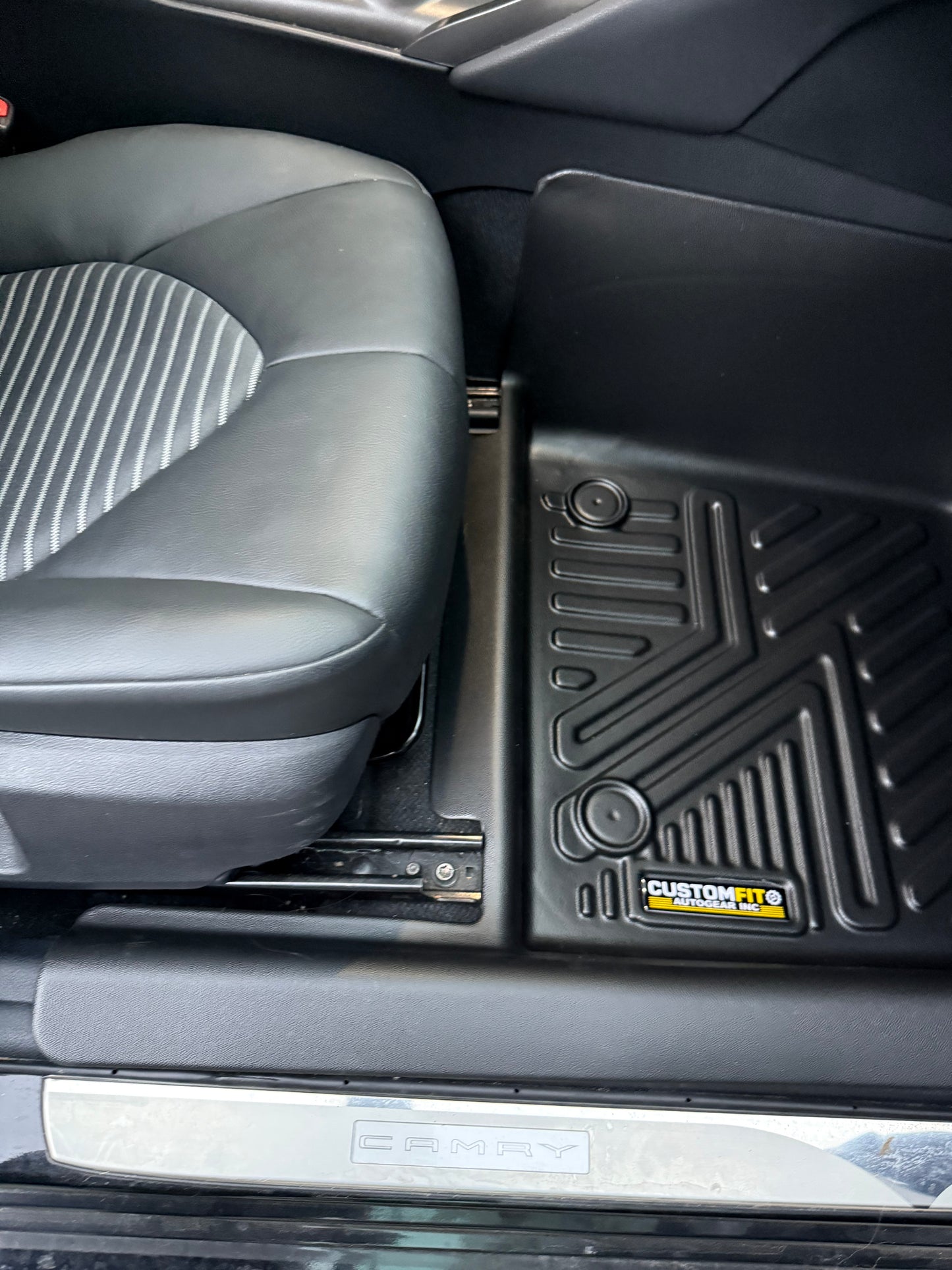 2018-2024 Toyota Camry Hybrid Passenger Seat interior with a custom-fit floor mat.