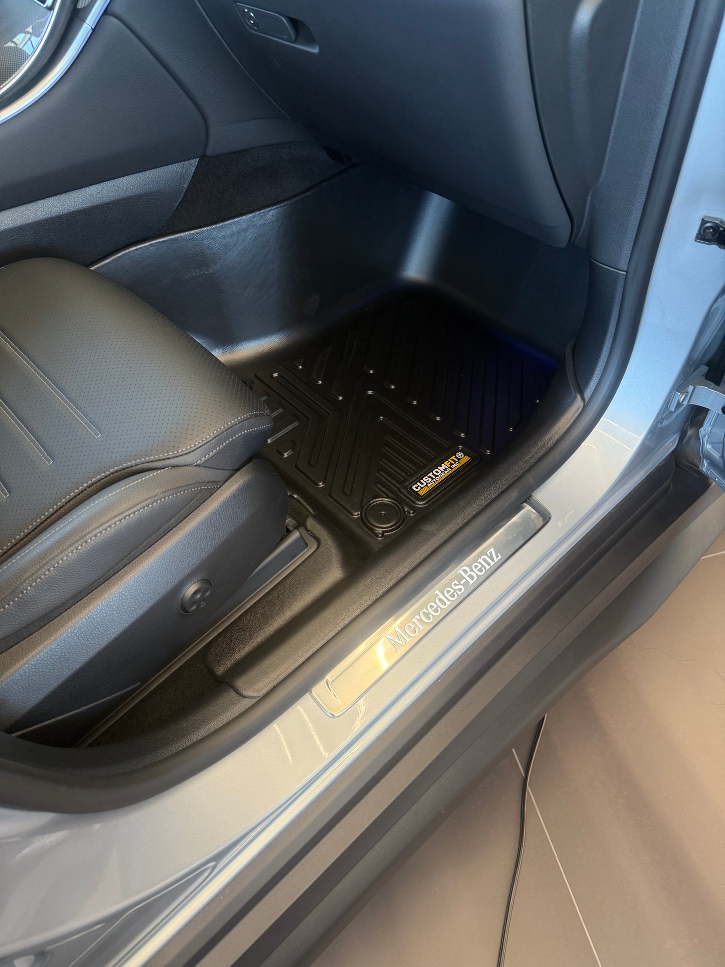 Mercedes Benz GLC 300 Car interior with a black floor mat on a gray carpeted floor