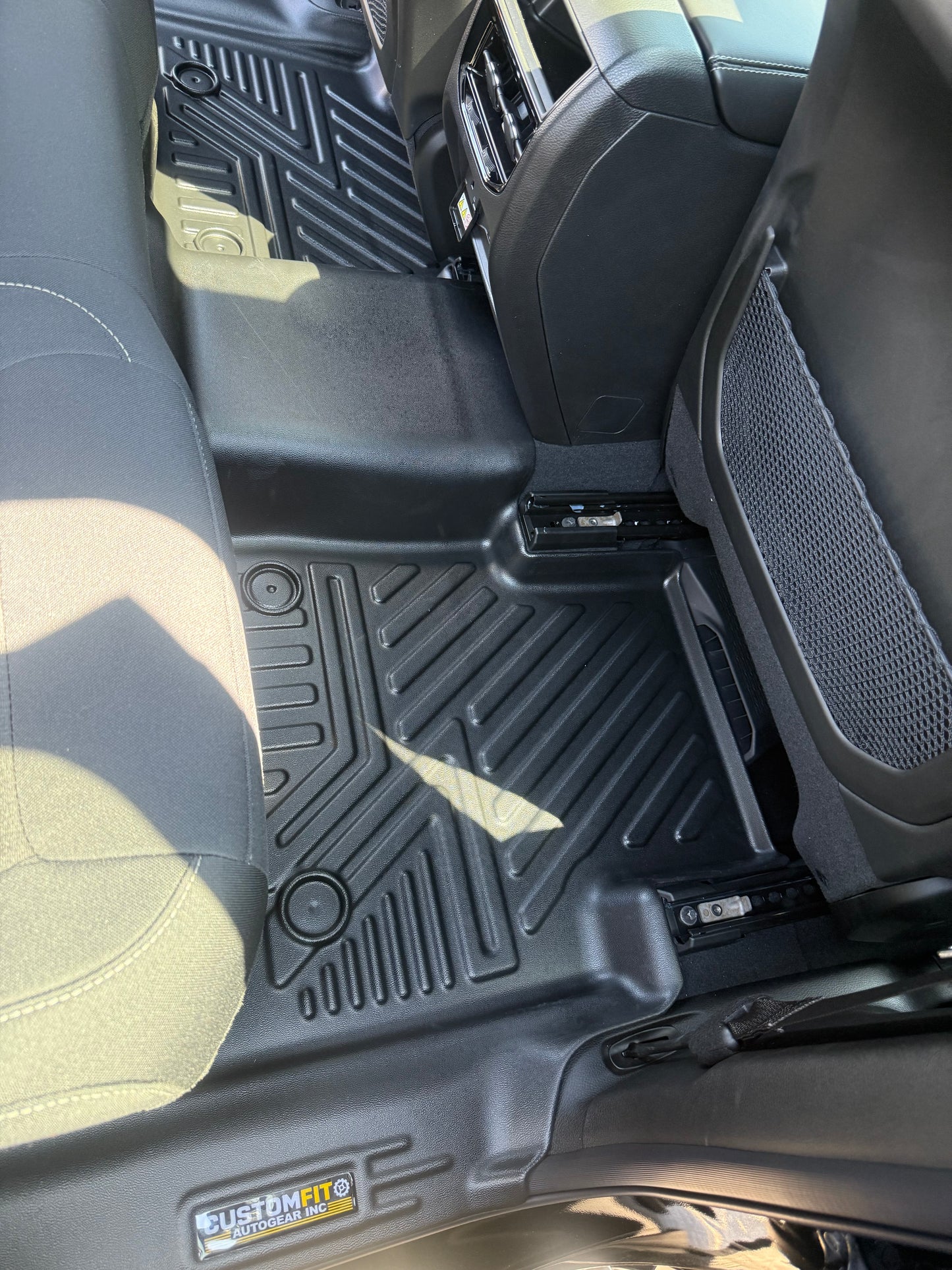 Jeep Grand Cherokee car floor mats with a visible customfit autogear brand logo in a vehicle interior.